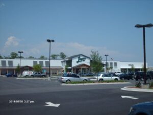 Lowes Foods suburban grocery store, shopping center with full parking lot.