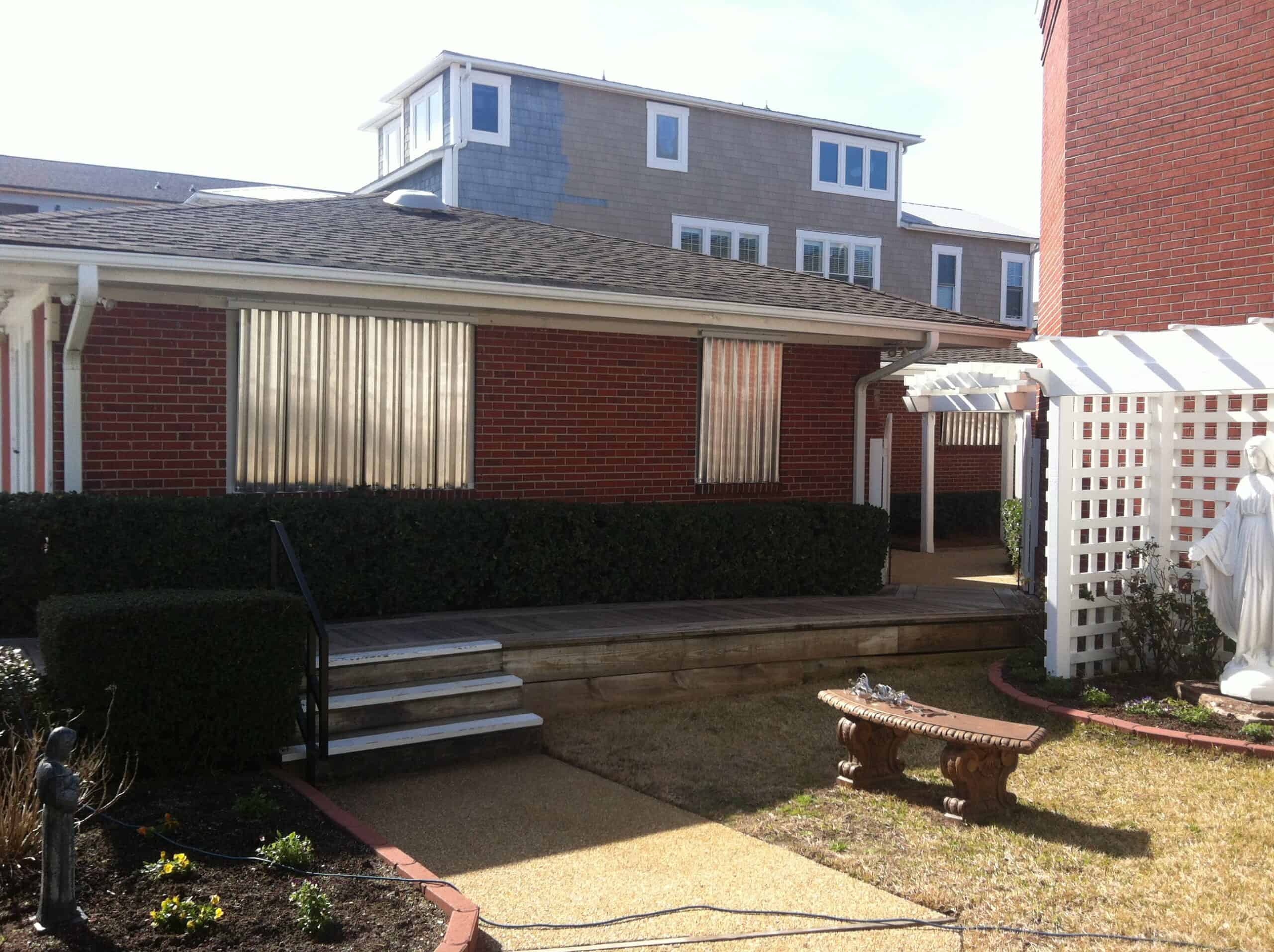 Hurricane storm panels deployed on the upper story of a coastal Carolina home