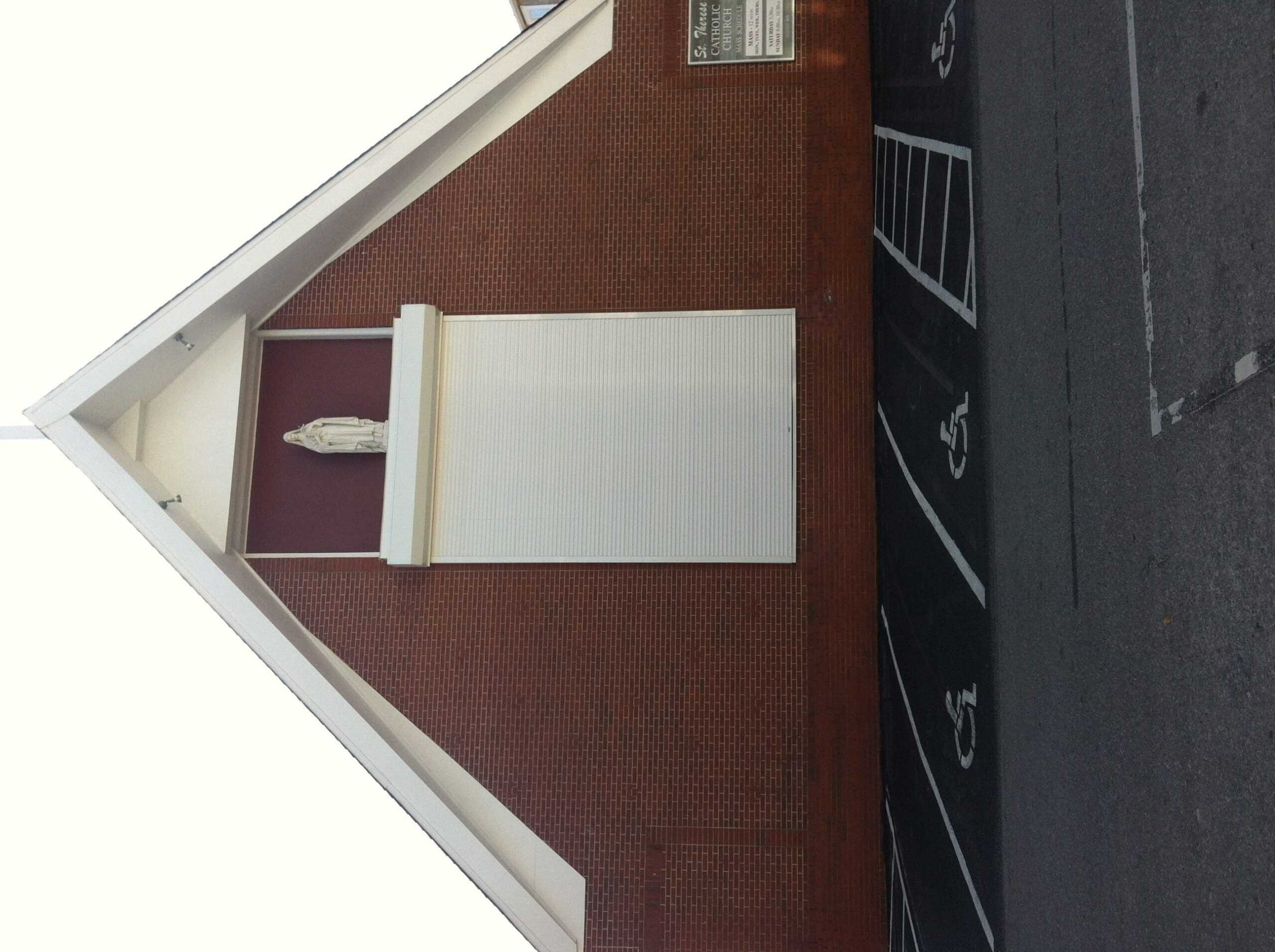 Rolldown hurricane shutters on a coastal Carolina home showing double-walled aluminum slats