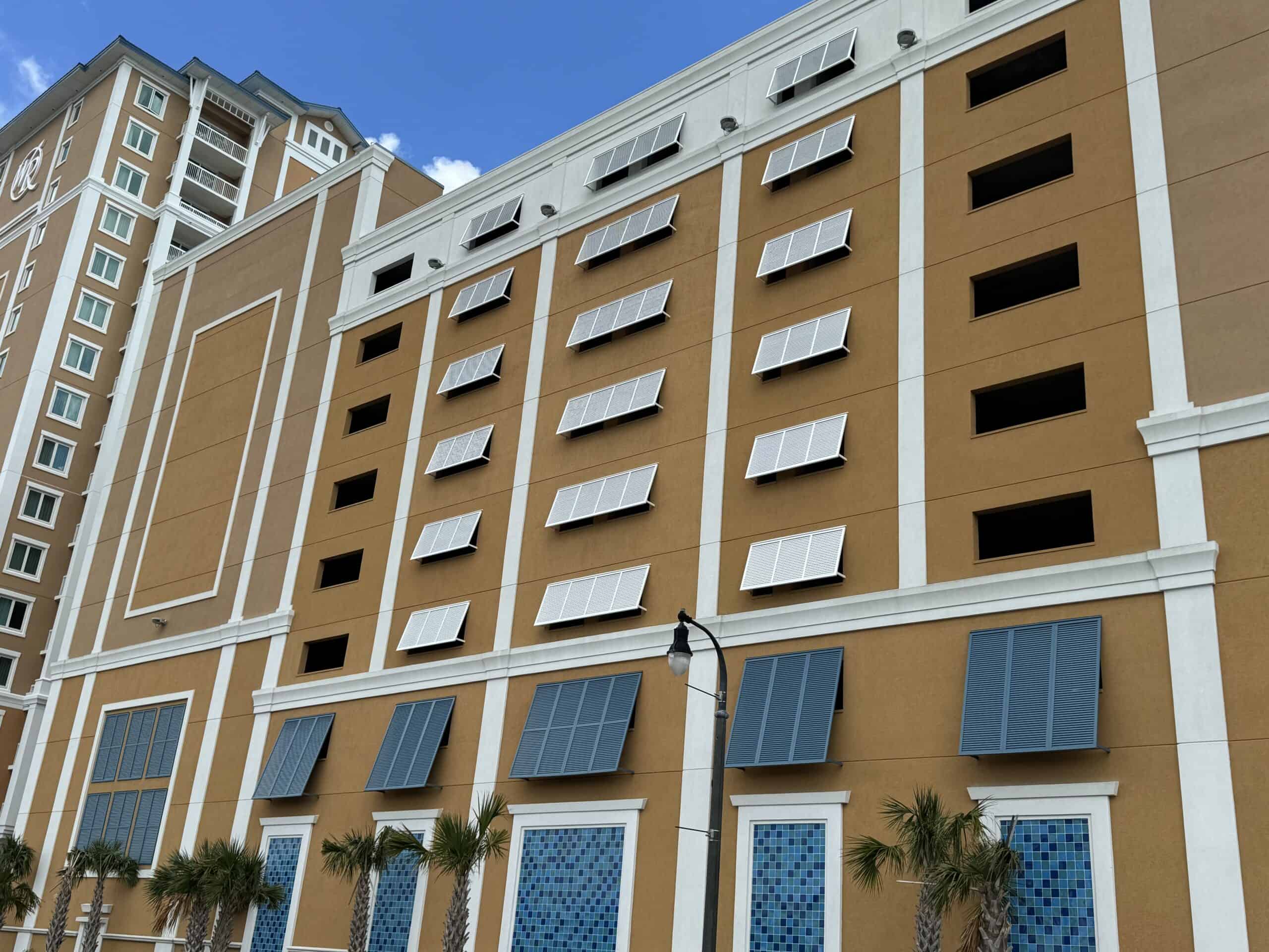 Bahama shutters in the open position providing shade and privacy on a beach house