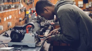 Young locksmith cutting keys with precision.