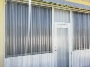 Lexan corrugated hurricane shutters protect Myrtle Beach building.