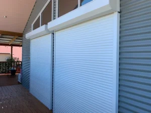 Myrtle Beach modern white hurricane roller shutters extended.