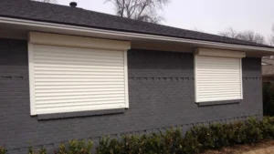 Myrtle Beach white roll-down hurricane shutters for security.