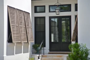 Elegant Wilmington home with open wood bi-fold hurricane shutters.