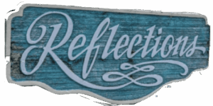 Elegant Reflections script on vintage teal wood sign.