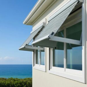 Accordion shutters on a coastal home, illustrating hurricane protection and aesthetic appeal