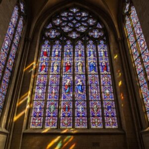 Clear polycarbonate storm panel fitted to a coastal window to preserve daylight and resist impacts