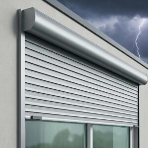 Close-up of roll down hurricane shutters deployed over a window, highlighting their storm protection features