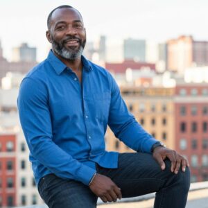 Coastal home with accordion shutters demonstrating hurricane protection features