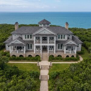 Coastal home with accordion shutters installed, showcasing storm protection features