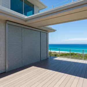 Coastal home with stylish accordion shutters retracted, showcasing architectural beauty and storm protection