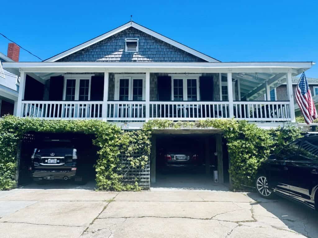 Surf City home featuring colonial hurricane shutters in Pender and Onslow Counties. Protect your home with AHS hurricane
