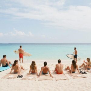 Motorized rolldown shutters on a modern coastal home showing fast deployment and a hidden housing