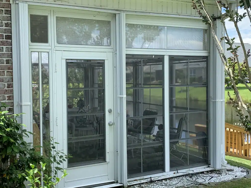 Ocean Isle Beach canal home with accordion hurricane shutters, Brunswick County. Protect your home with our quality