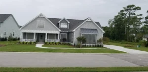 Corrugated aluminum storm panels stacked and installed on a residential home in Ogden Wilmington NC.