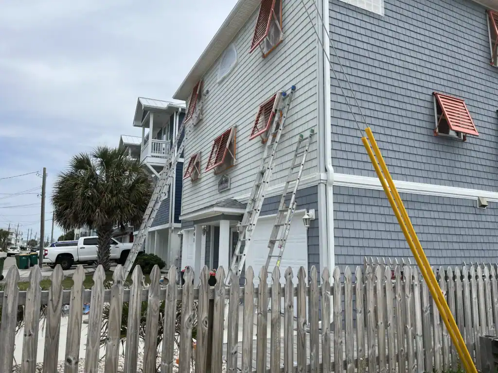 Southport, NC home features Bahama hurricane shutters from Brunswick County. These shutters blend protection with