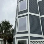 Clear Lexan polycarbonate shutters installed on a high-wind zone home on Bald Head Island.