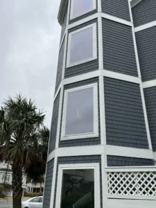 Clear Lexan polycarbonate shutters installed on a high-wind zone home on Bald Head Island.