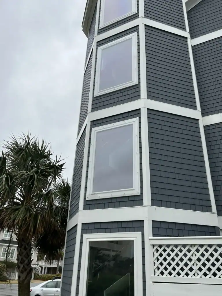 Bald Head Island home featuring clear Lexan hurricane shutters. Brunswick County homes rely on quality storm protection