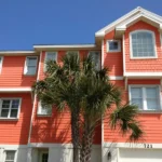 Optically clear Lexan polycarbonate shutters installed on a modern home in Wrightsville Beach NC.
