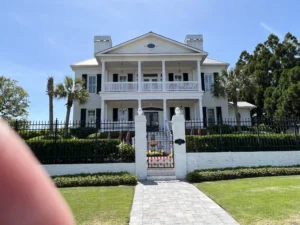 Black Colonial hurricane shutters installed on a home in Brunswick Forest Leland NC.
