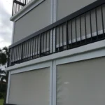 Retractable hurricane screens protecting a golf villa lanai in Barefoot Resort North Myrtle Beach.