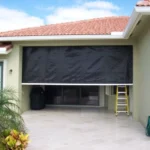 Retractable hurricane screens protecting a golf course lanai in Crow Creek Calabash.