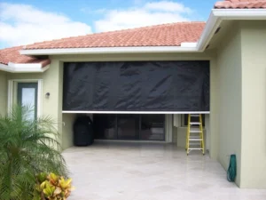 Retractable hurricane screens protecting a golf course lanai in Crow Creek Calabash.