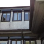 Motorized rolling storm shutters protecting a luxury oceanfront estate on Figure Eight Island NC.