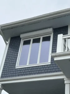 Motorized rolling storm shutters on a luxury home in Grande Dunes Myrtle Beach.